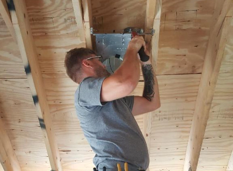 Electrician installing electrical lines