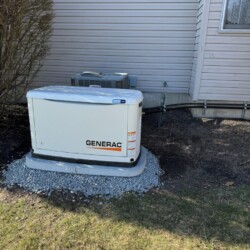 Generac home generator installed outside of house.