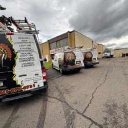 Construction vans parked in a parking lot