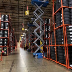 Warehouse full of tires on rows of shelves
